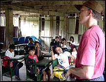 Creative Connections Project Director working with students in the Amazon Rain Forest.